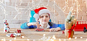 Child playing with toy from Santa Claus at home