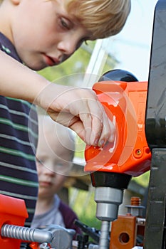 Child Playing with Toy Tools