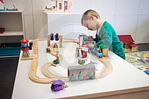 Child playing with toy train