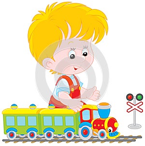 Child playing with a train