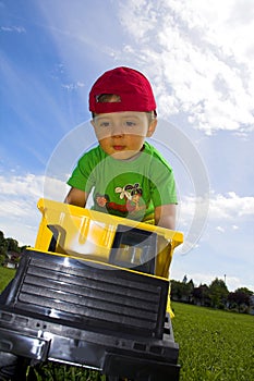 Child playing with truck