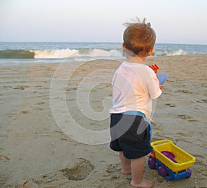 Child Playing with truck at the beach