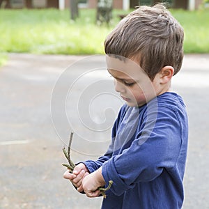 Child playing with twigs