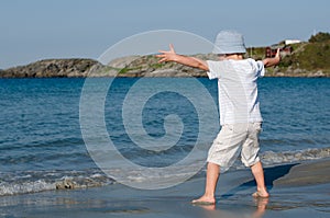 A child playing with waves