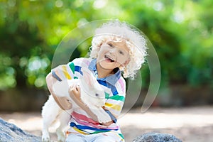 Child with rabbit. Easter bunny. Kids and pets.