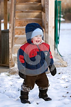 Child playing in winter snow