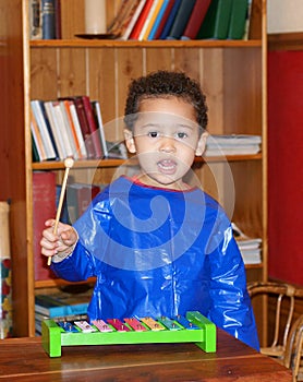 Child playing xylophone