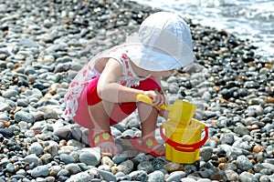 Child plays with a bucket