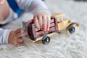 Child plays with car photo