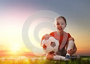 Child plays football.