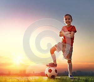 Child plays football.