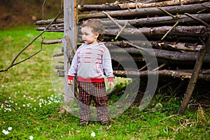 A child plays with a Frisbee outdoors.