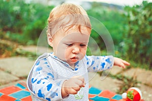 A child plays on the grass