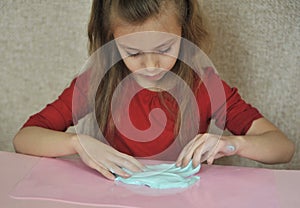 Child plays with home-made slime.