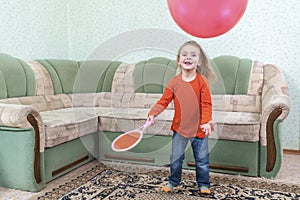 Child plays with an inflatable ball