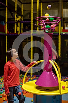 Child Plays in Play Center