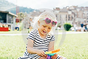 The child plays rubber antistress simple dimple.