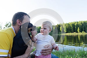 A child plays with a small dog