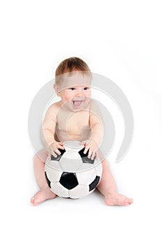 Child plays with a soccerball photo