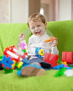 Child plays with toys in home