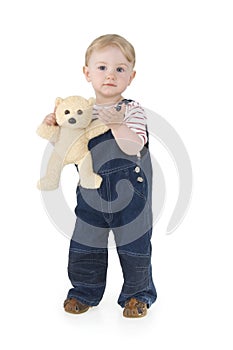 Child with plushy cuddle-bear