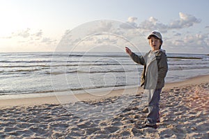 Child pointing out to sea