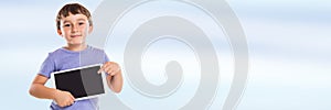 Child pointing at tablet computer boy banner copyspace copy space information marketing