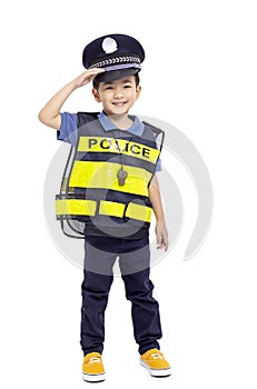 child police officer standing before white background