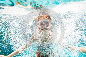 Child in the pool underwater