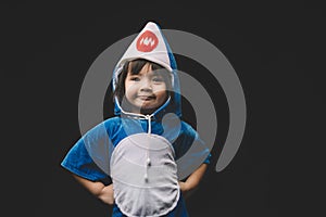 Child portrait with baby shark costume in studio