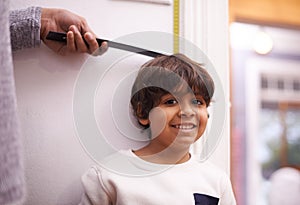 Child, portrait and measure height growth with ruler for childhood development, taller or elementary school. Boy photo