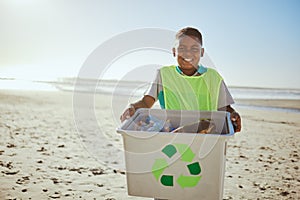 Child, portrait and recycling, clean beach with box and plastic bottle, environment and climate change with nature