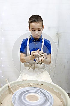 Child at pottery wheel