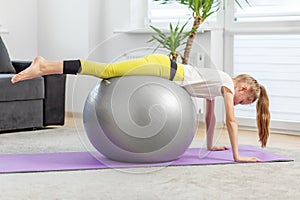 Child Practicing Plank Exercise on Fitness Ball