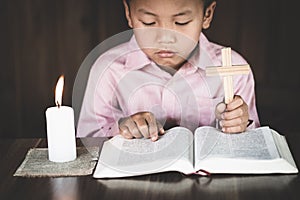 Child  praying for christian religion,The boy who intended on the cross, Religion concept