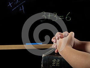 Child praying in school