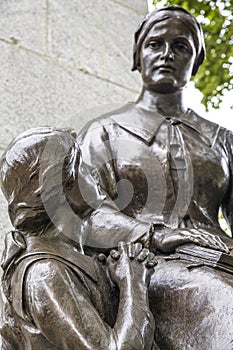 Child praying towards her mother in Quebec City