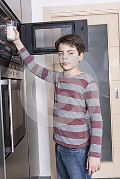 Child preparing a glass of milk