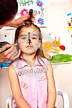 Child preschooler with face painting.