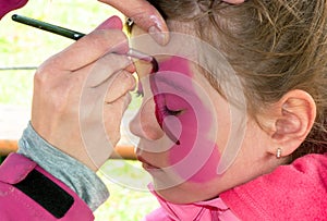Child preschooler with face painting
