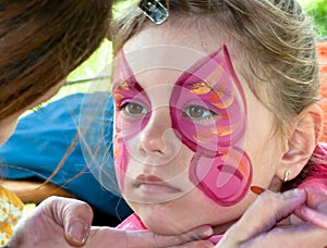 Child preschooler with face painting