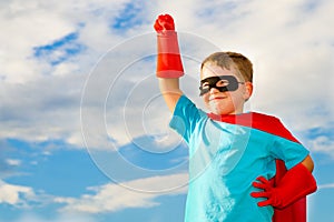 Child pretending to be a superhero