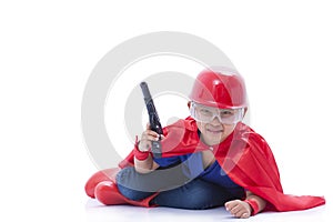 Child pretending to be a superhero with toy gun