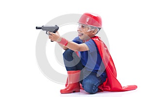 Child pretending to be a superhero with toy gun