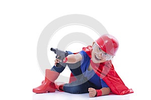 Child pretending to be a superhero with toy gun