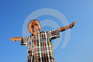 Child Pretending to Fly photo