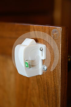 Child-proofed cabinet magnetic lock active
