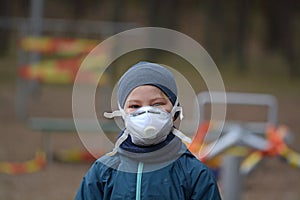 Child with protective face mask during coronavirus outbreak