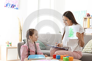 Child psychologist working with little girl