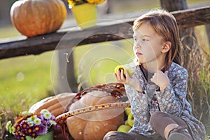 Child with pumpkins